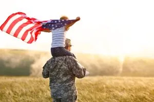 Child holding American Flag