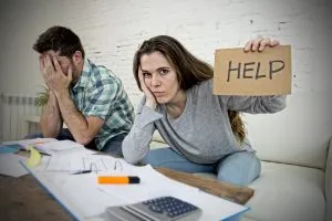 woman holding signage for help